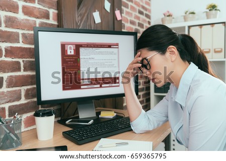 sadness company agent woman finding working computer getting blackmail virus attack thinking solution at office desk and feeling depression. Royalty-Free Stock Photo #659365795