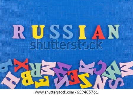 Russia word on blue background composed from colorful abc alphabet block wooden letters, copy space for ad text. Learning english concept