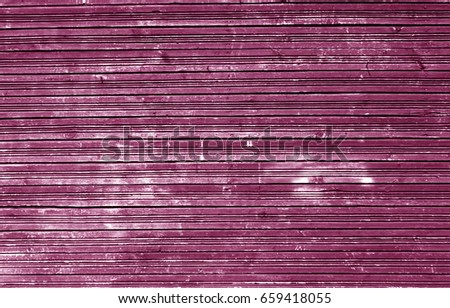 Grungy weathered pink color wood wall. Abstract background and texture for design