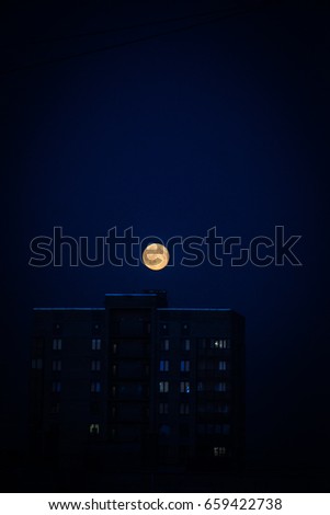 A big bright moon in the night sky