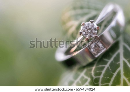 Wedding ring on leaf