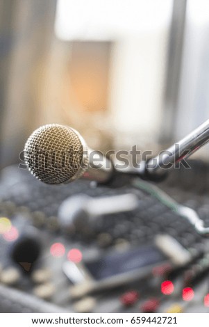 The microphone on the audio mixer. In the recording studio.