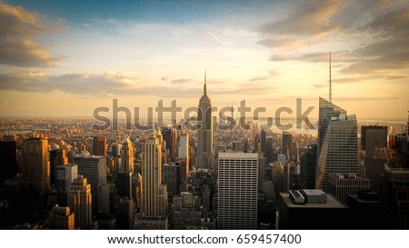 New York City skyline with urban skyscrapers on the top of the world at sunset