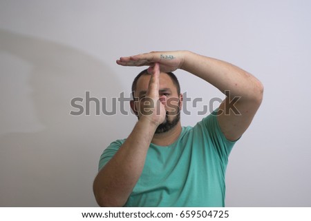 A man shows the hands stop timeout.