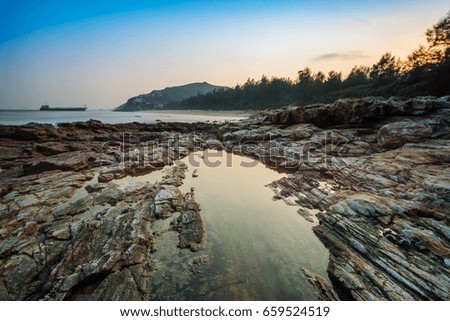 stones in the water with slow shutter speed shore coast landscap