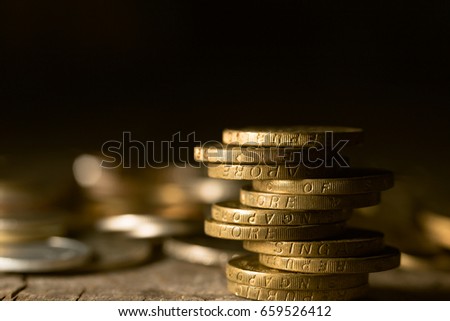 Close up of stacking coins saving business concept, low key photo