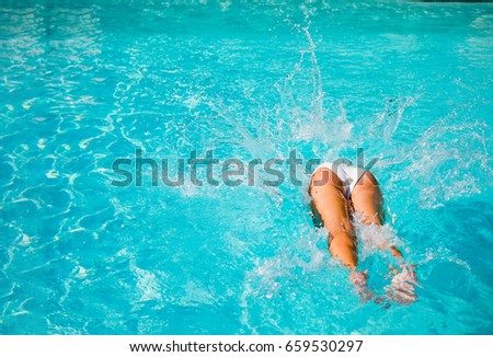 Woman diving in the swimming pool