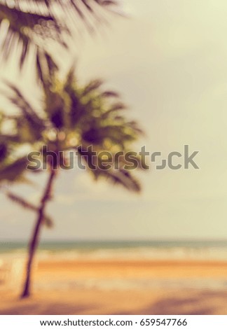 Abstract blur image of  beach  on day time for background usage . (vintage tone)