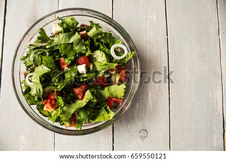 bowl of fresh salad with tomato and cheese onion Royalty-Free Stock Photo #659550121