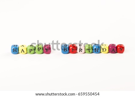 Baby Blocks spelling the words HAPPY BIRTHDAY colored letter cube