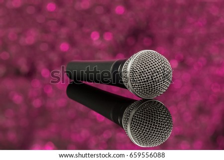Microphone in defocus pink background, mic. Front view