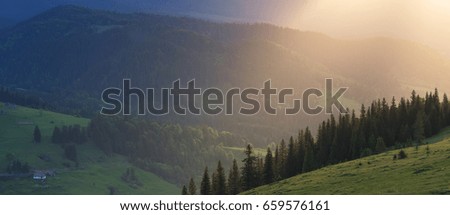 Mountain panorama during sundown. Beautiful natural landscape in the summer time