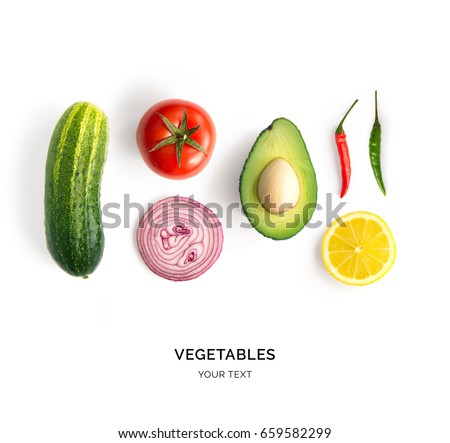 Creative layout made of avocado, onion, tomatoes, pepper and lemon. Flat lay. Food concept. Vegetables isolated on white background. Royalty-Free Stock Photo #659582299