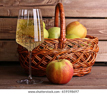 Basket of apples rustic style lemonade made from juice cider with alcohol bubbles 