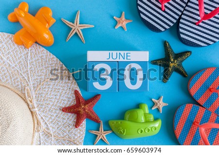 June 30th. Image of june 30 calendar on blue background with summer beach, traveler outfit and accessories. Summer time
