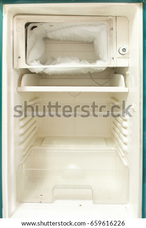 Empty open fridge,old refrigerator. Royalty-Free Stock Photo #659616226