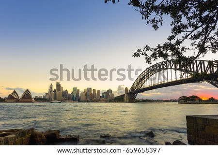 View of the Sydney Harbor and cityscape. 
