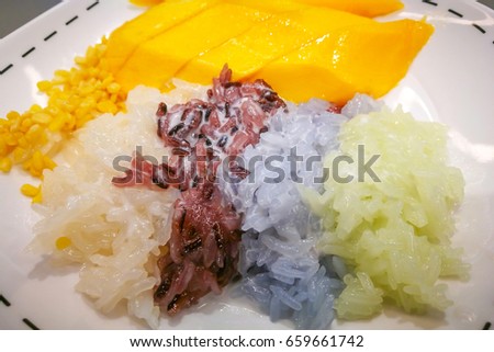 sticky rice and ripe mango on the white plate.