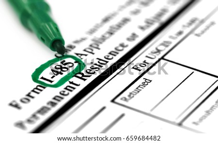 I 485 application application form with green sign pen