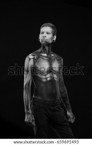 Black and white portrait, Character for computer game
Bodyart cyborg, male with pattern on body on black background