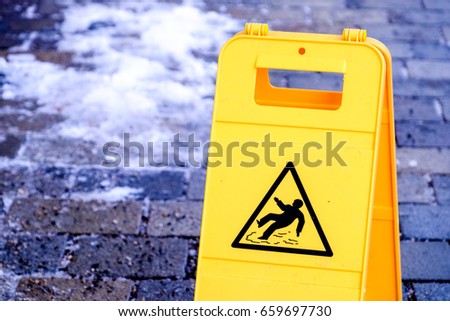 caution wet floor sign at a sidewalk