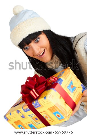 Young woman holding a gift isolated on white background