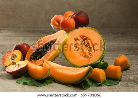 summer orange color fruits over wood