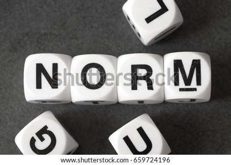 word norm on white toy cubes Royalty-Free Stock Photo #659724196