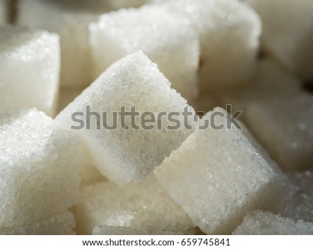 Close up shot of white refinery sugar. Royalty-Free Stock Photo #659745841