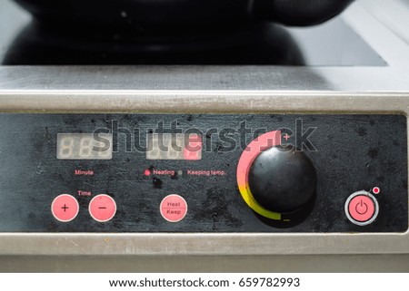 Close up electric stove controls
