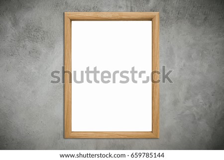 Mock up natural brown wood frame with blank poster hanging on old grungy texture grey concrete wall in loft room style