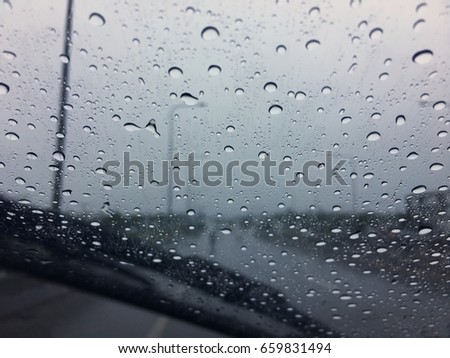 Raindrop on glass car.