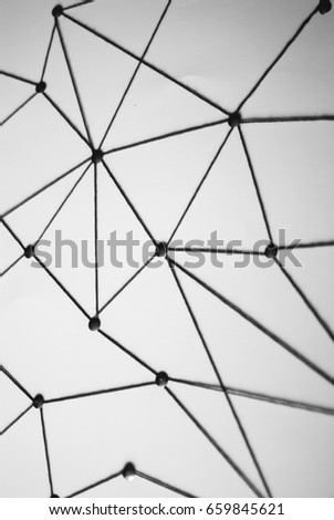 Background. Abstract concept (idea) of network, social media, internet, teamwork,  communication. Thumbtacks linked together by red thread. Isolated. Entities connected.