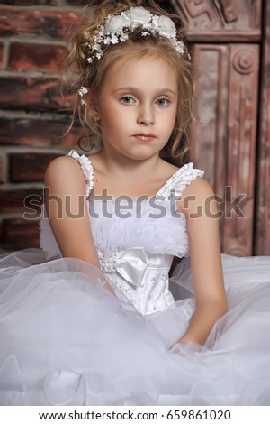 Little girl in wedding dress