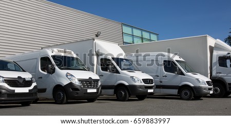 park society specialized delivery with small trucks and van Royalty-Free Stock Photo #659883997