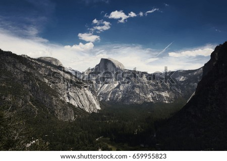 Sweeping panoramic view of half-dome in Yosemite National Park.