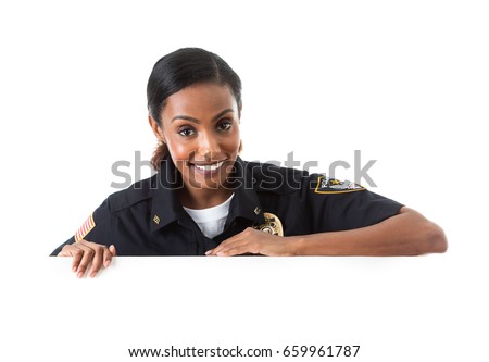 Police: Policewoman Looking Over White Card To Camera Royalty-Free Stock Photo #659961787