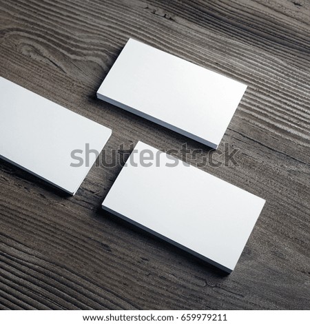 Photo of blank business cards on wooden background. Template for ID. Responsive design mock up. Top view.