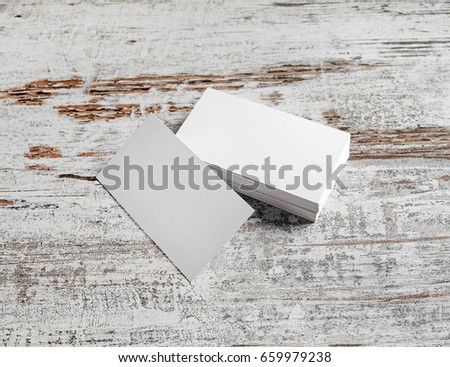 Photo of blank business cards blank business cards on vintage wooden floor background.
