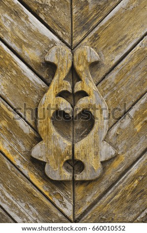 Old wooden door with a pattern. Vintage time-worn door.