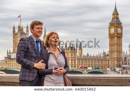 Adult son with his aged mother in London, UK