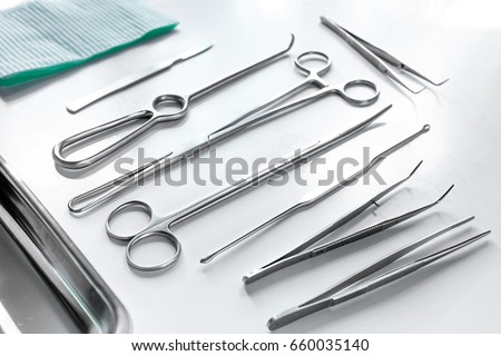 Medical instruments for cosmetic surgery on white table backgrond Royalty-Free Stock Photo #660035140
