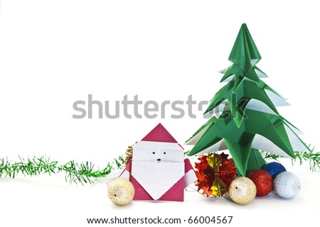 Origami Japanese christmas tree and Santa decorated with ornaments.