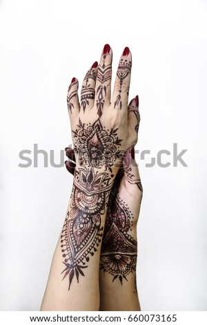 Henna Hands painting art indian holding white background original design One female hand, image of henna pattern. Short manicure nails. Beautiful,Close up professional,wedding design