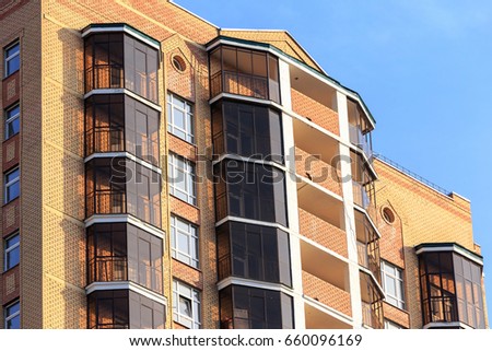 High rise building windows texture with sky reflections.