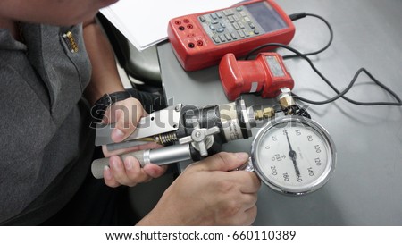 Pressure Guages, instrument indicating pressure in Training calibration Laboratory Royalty-Free Stock Photo #660110389