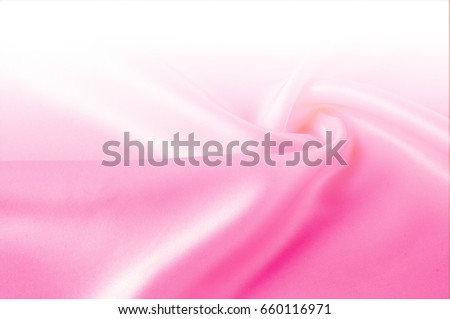Texture, background, pattern. Light beige, pink shades of silk fabric, text space. Pink silk background based on natural texture