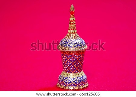 Ceramic cup on red background