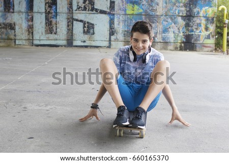 boy with skateboard on the street