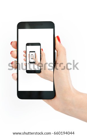 Close-up of woman hand holding smartphone with repetitive image, picture in picture effect